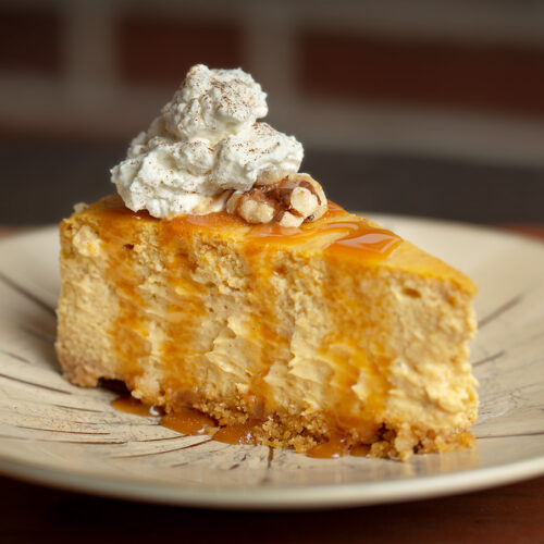 Pumpkin Cheesecake with caramel, and nut crust.