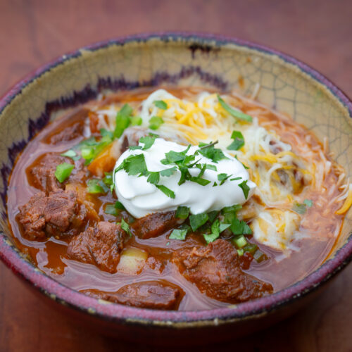 Smoked Chili topped with cheese and sour cream.